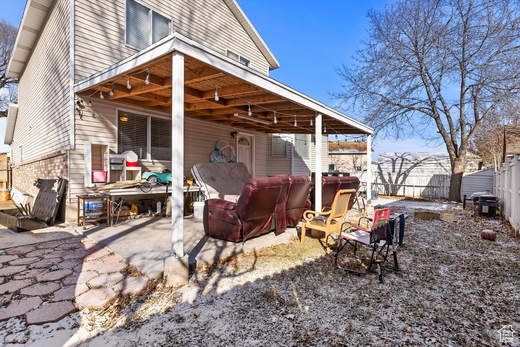 Rear view of house with a patio area