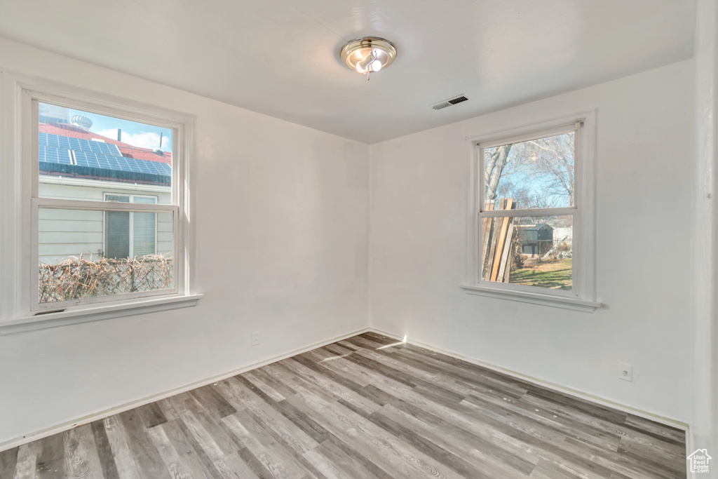 Unfurnished room featuring wood-type flooring