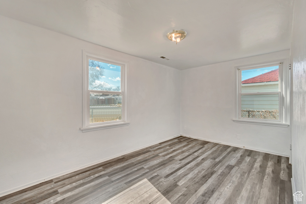 Spare room with hardwood / wood-style floors