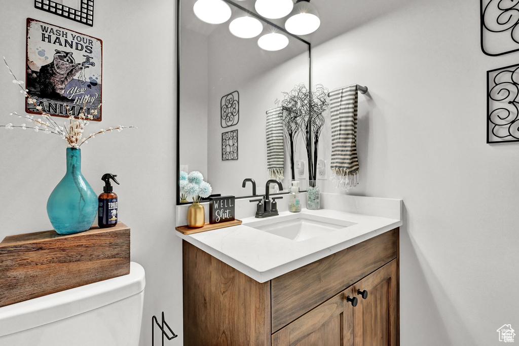 Bathroom featuring vanity and toilet