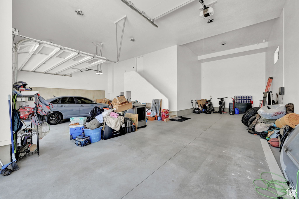 Garage featuring a garage door opener