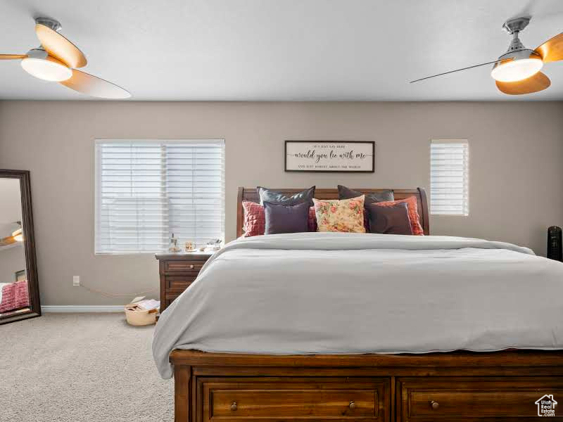 Bedroom with ceiling fan and carpet flooring