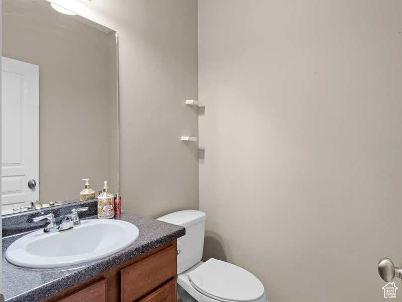 Bathroom featuring vanity and toilet