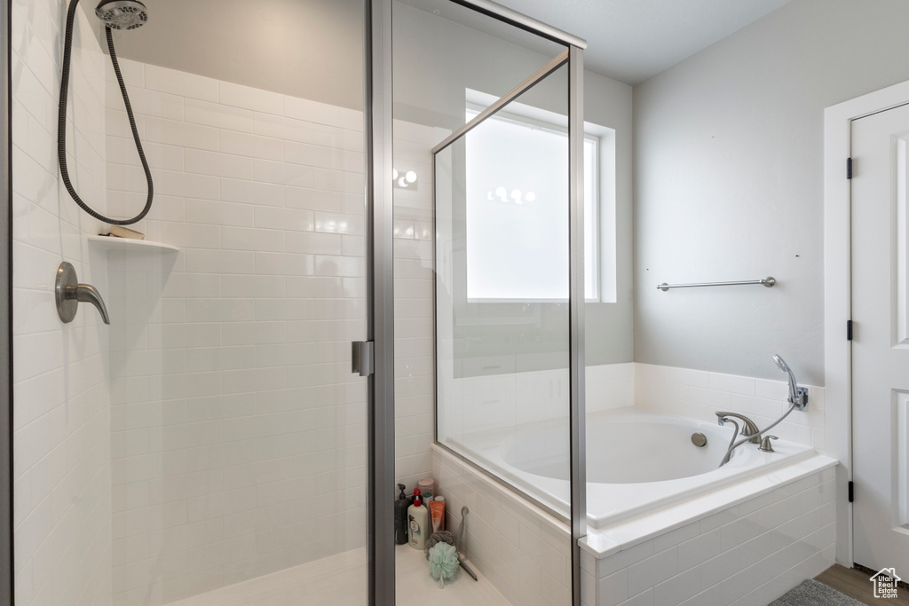 Bathroom featuring plus walk in shower