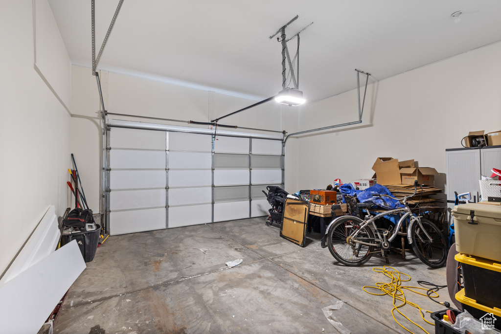 Garage featuring a garage door opener