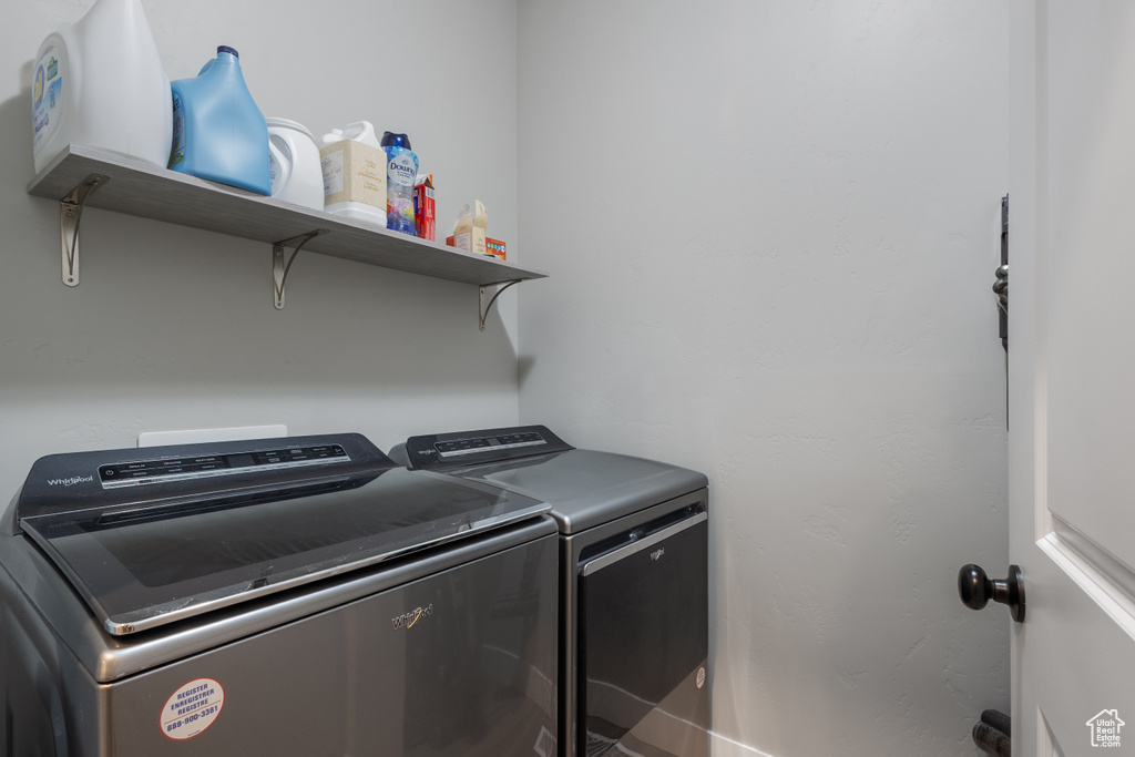 Washroom featuring washing machine and dryer