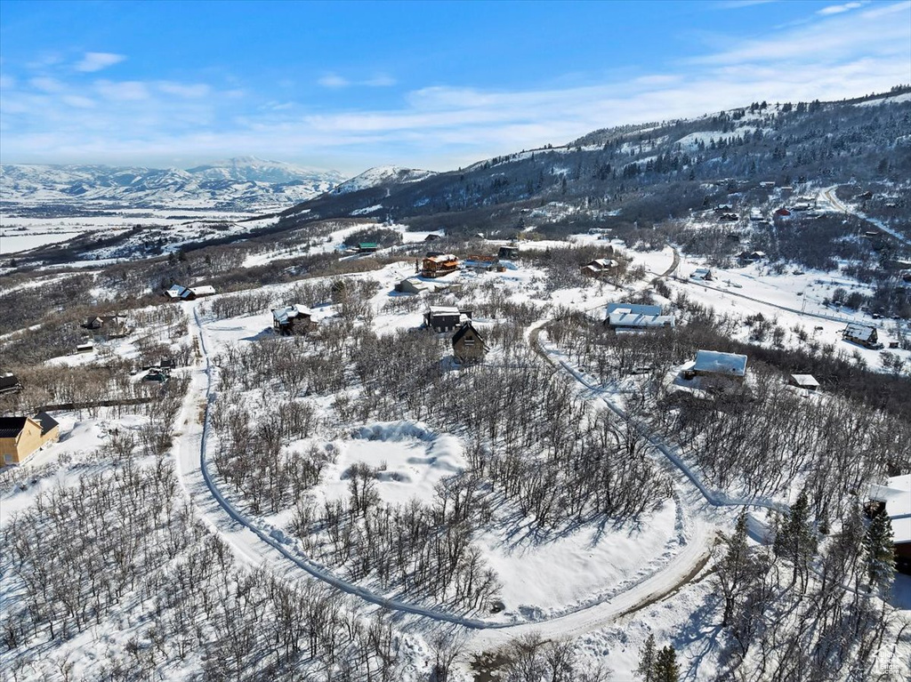 Snowy aerial view with a mountain view