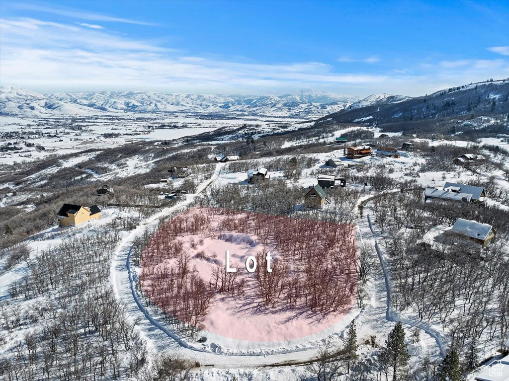 Snowy aerial view featuring a mountain view