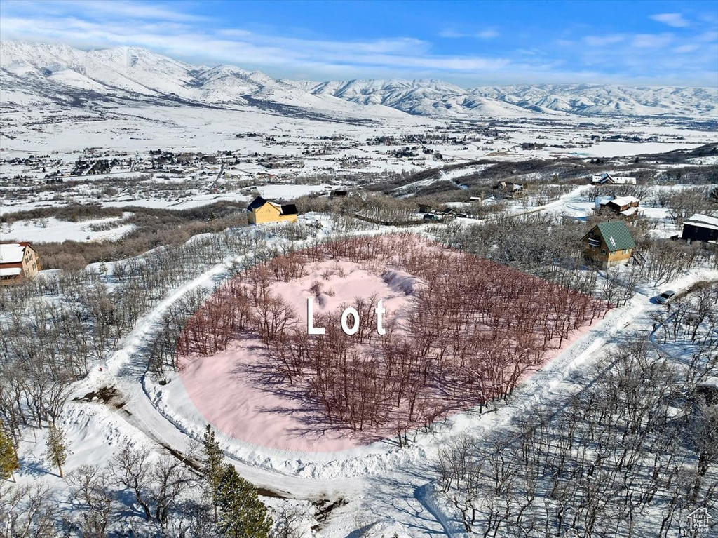 Snowy aerial view with a mountain view