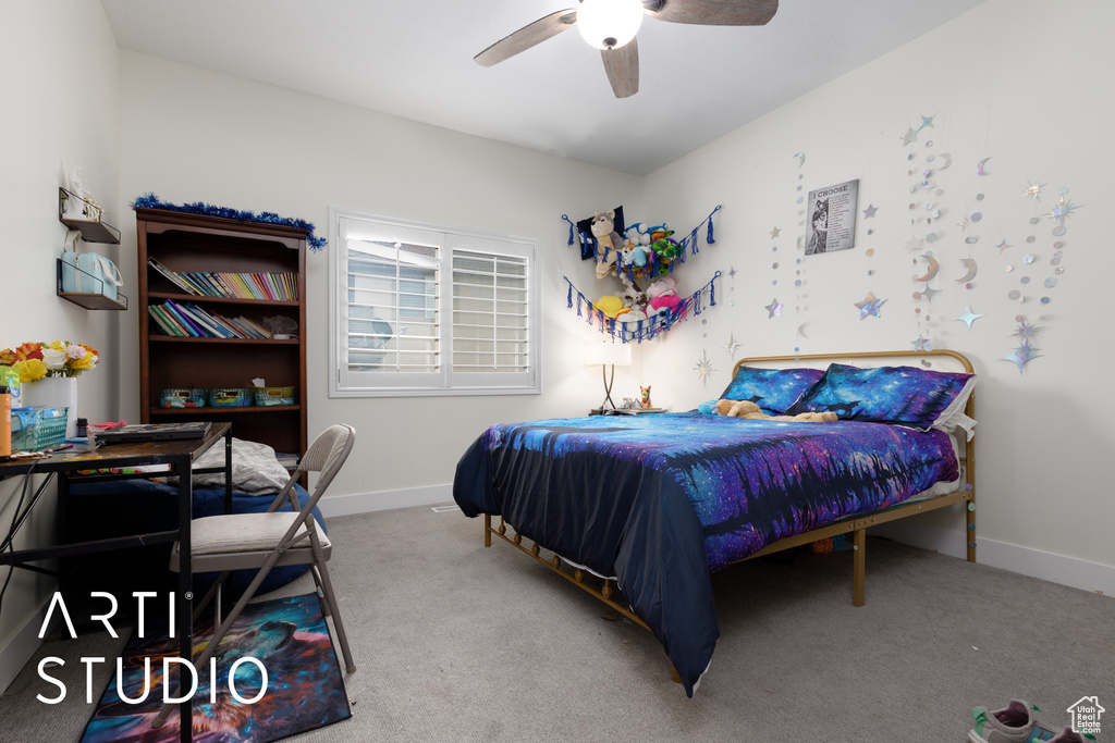 Bedroom featuring carpet and ceiling fan