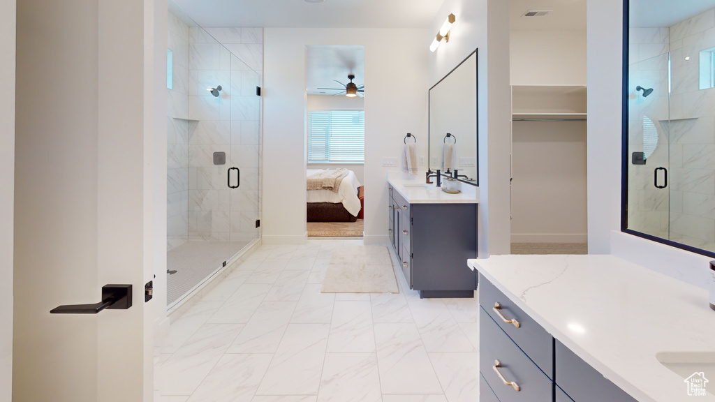 Full bathroom featuring visible vents, marble finish floor, vanity, and a shower stall