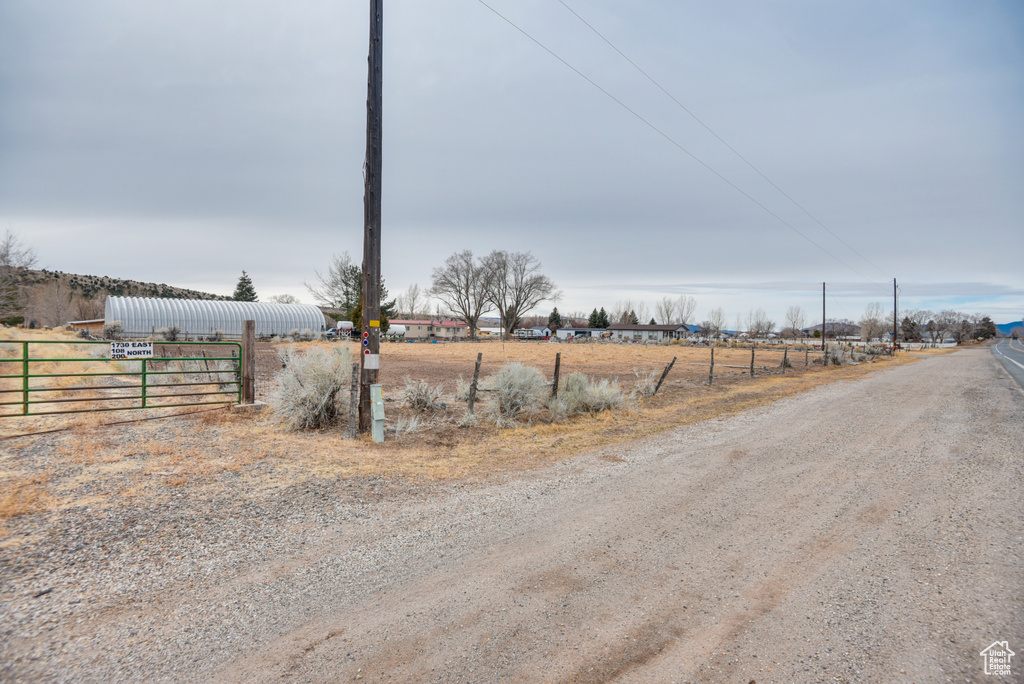 View of road featuring a pole building and a rural view