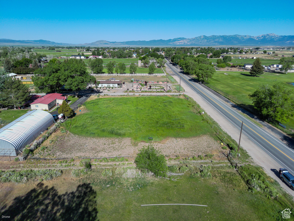 View of property location featuring a mountain backdrop and rural landscape