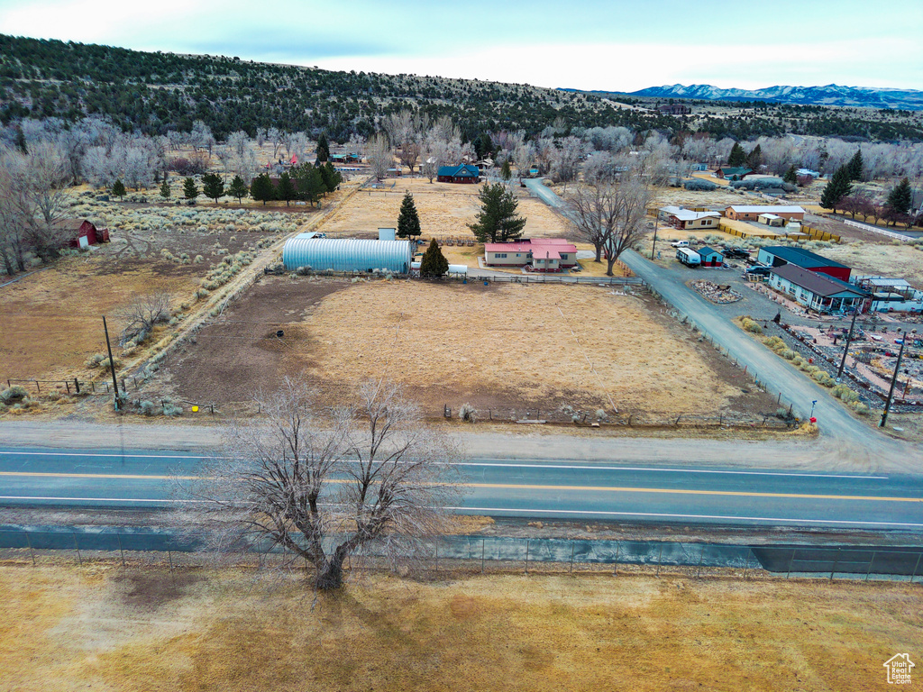 Birds eye view of property featuring a mountain view and a rural view