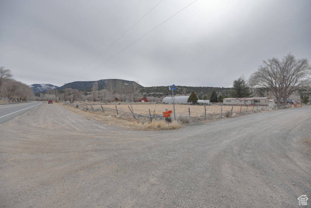 View of street with a rural view and a mountain view