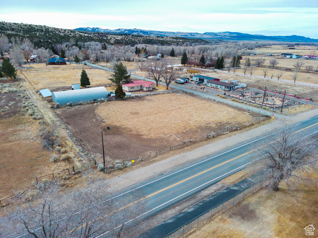 Drone / aerial view with a mountain view and a rural view