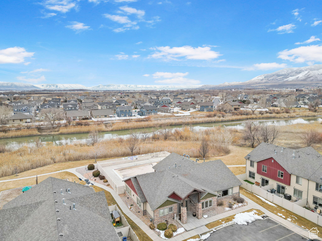 Drone / aerial view with a residential view and a water and mountain view