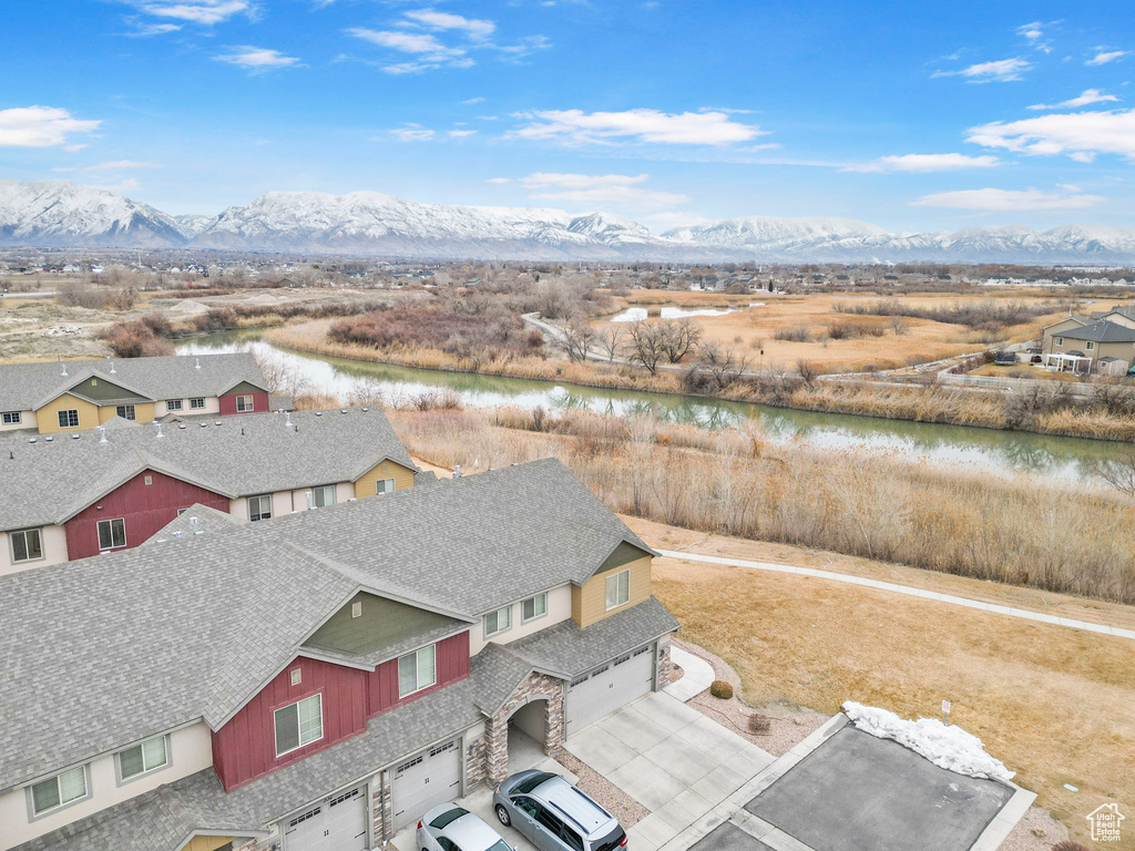 Birds eye view of property featuring a residential view and a water and mountain view