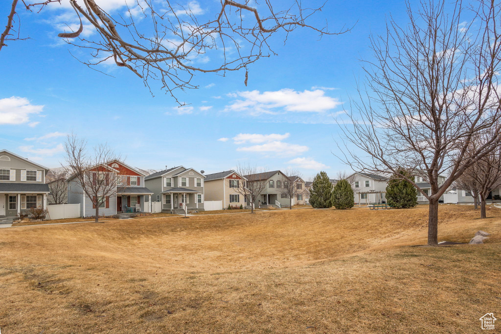 View of yard featuring a residential view and fence