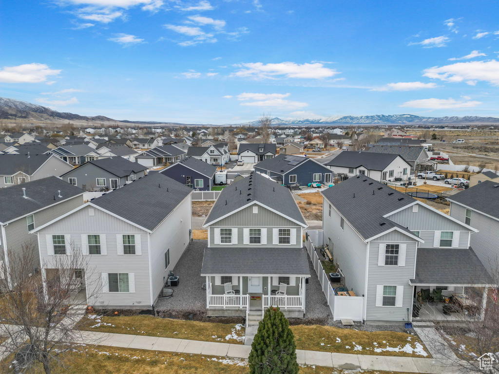 Drone / aerial view featuring a mountain view and a residential view