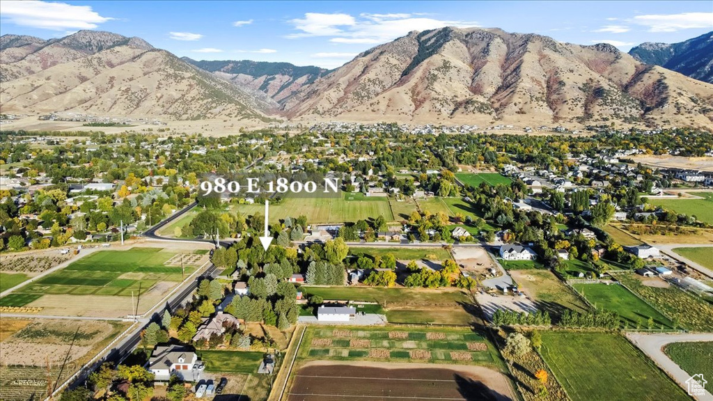 Birds eye view of property with a mountain view