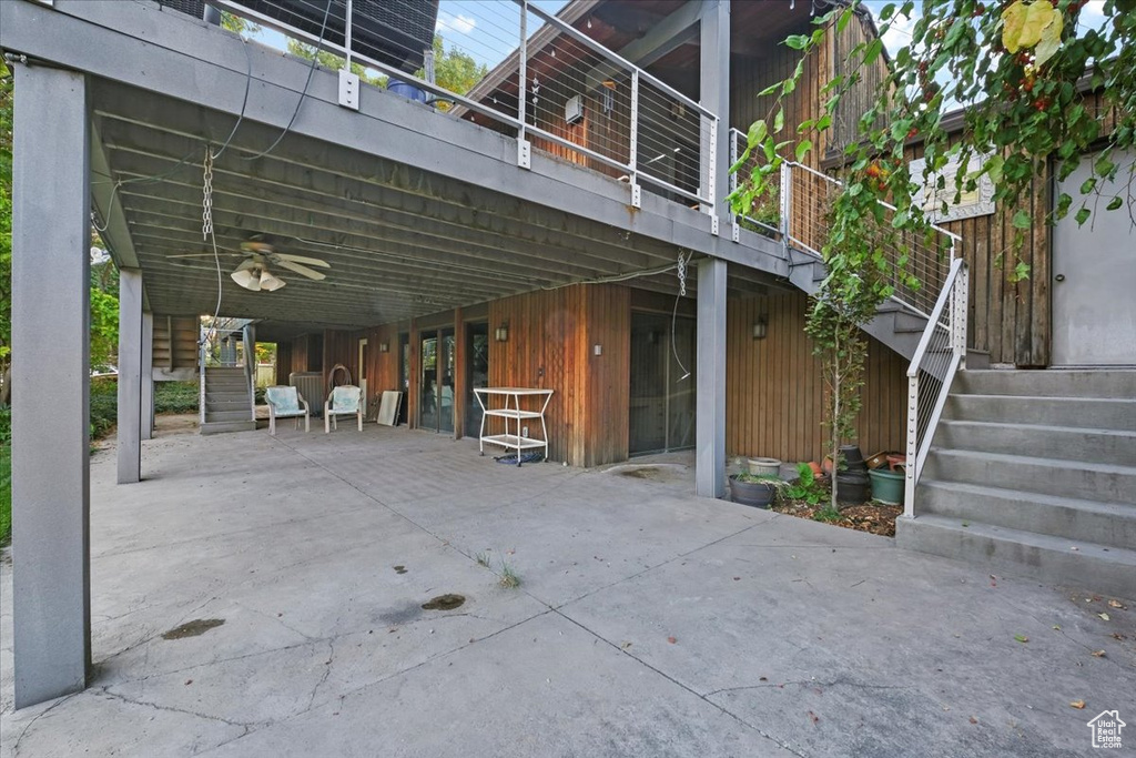 Exterior space featuring ceiling fan and a patio area