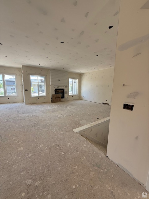 Unfurnished living room with a fireplace