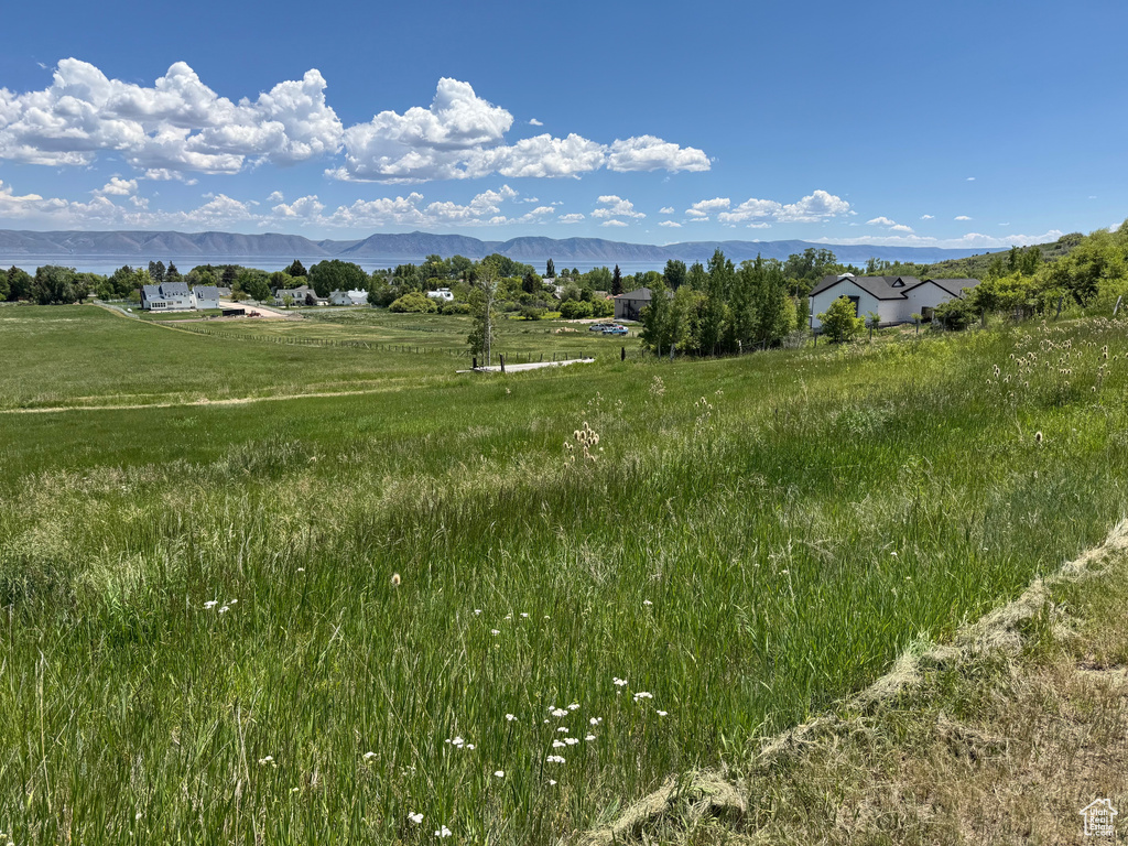View of mountain backdrop featuring rural landscape