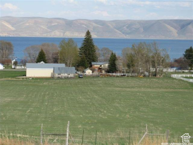 View of mountain feature featuring a rural view and a water view