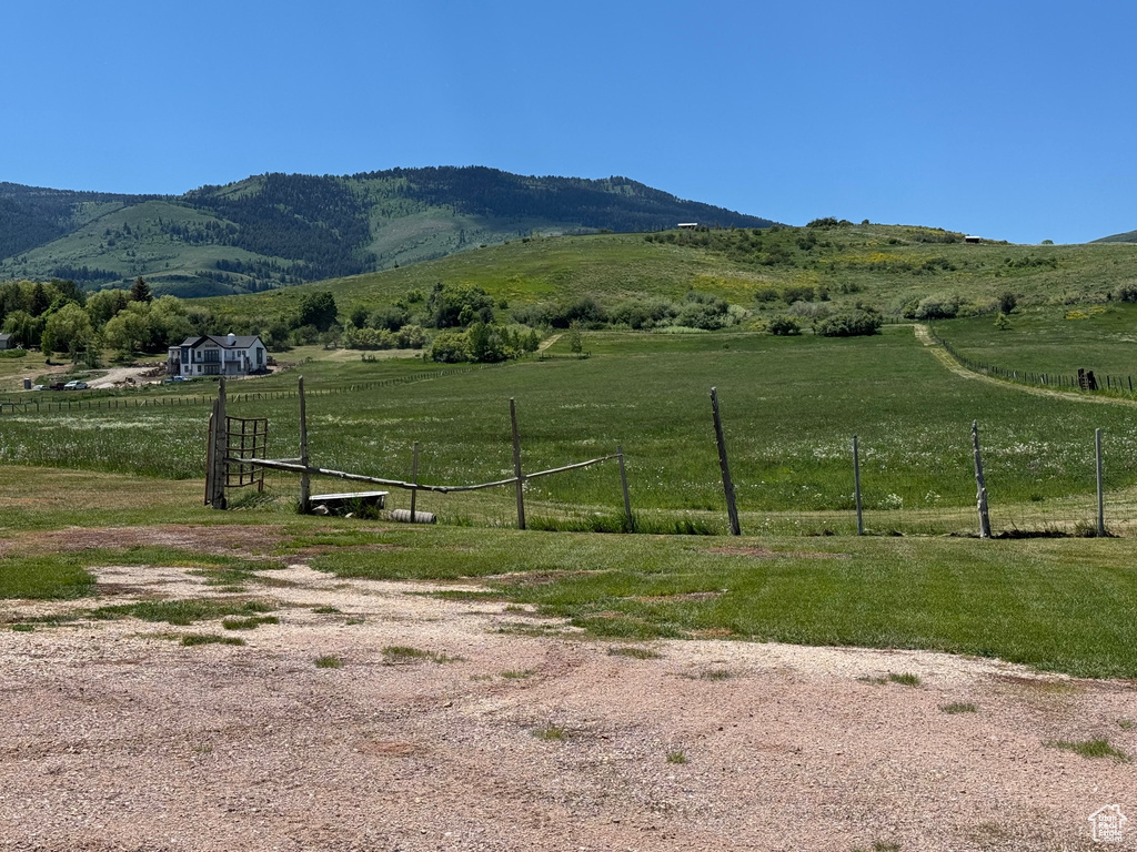 View of mountain backdrop featuring rural landscape