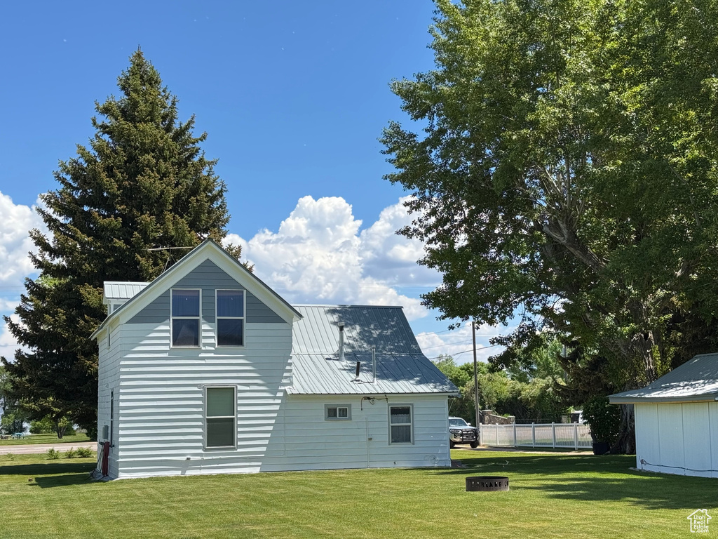 Back of house with a metal roof