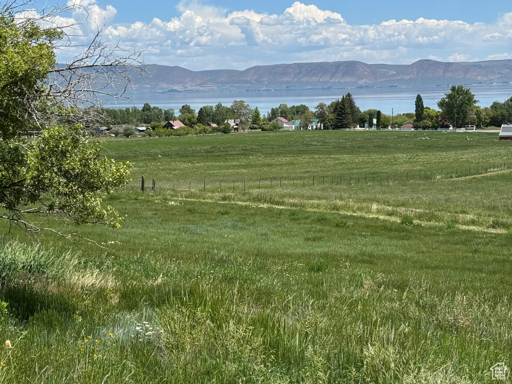View of mountain backdrop featuring a large body of water