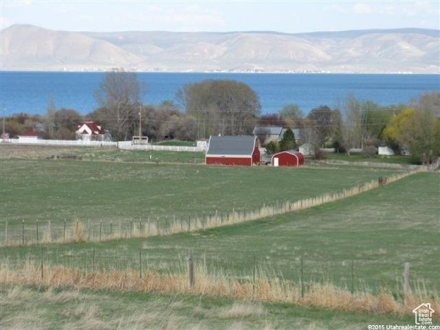 Exterior space with a rural view, a mountain view, and fence