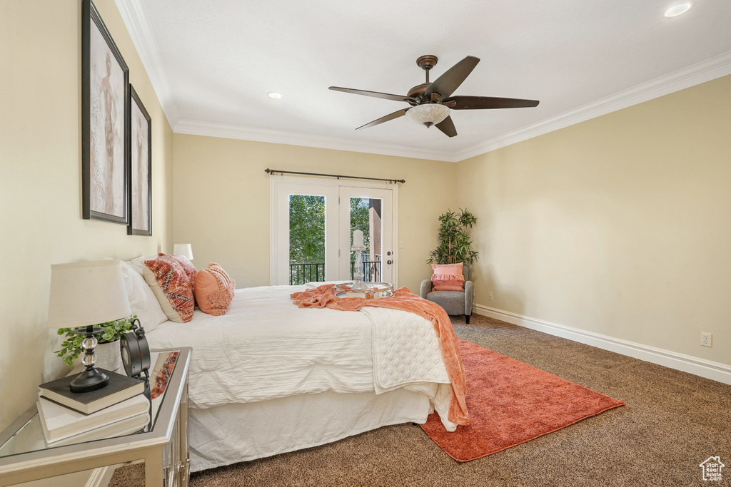 Carpeted bedroom featuring baseboards, access to outside, ceiling fan, and crown molding