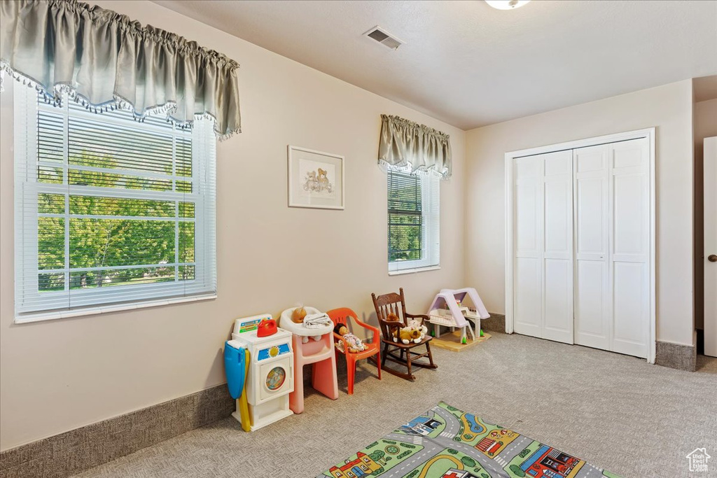 Rec room with carpet floors and visible vents