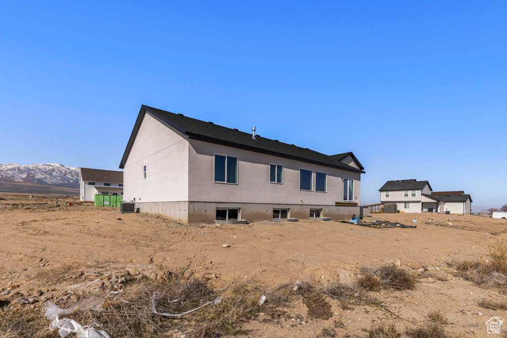Back of property featuring central AC unit