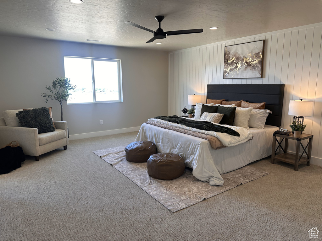 Bedroom featuring carpet flooring, baseboards, recessed lighting, ceiling fan, and a textured ceiling