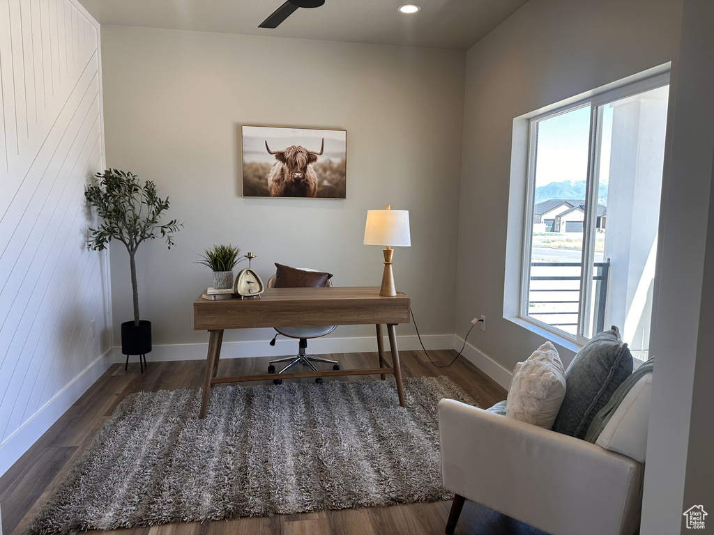 Office space featuring baseboards, wood finished floors, and recessed lighting