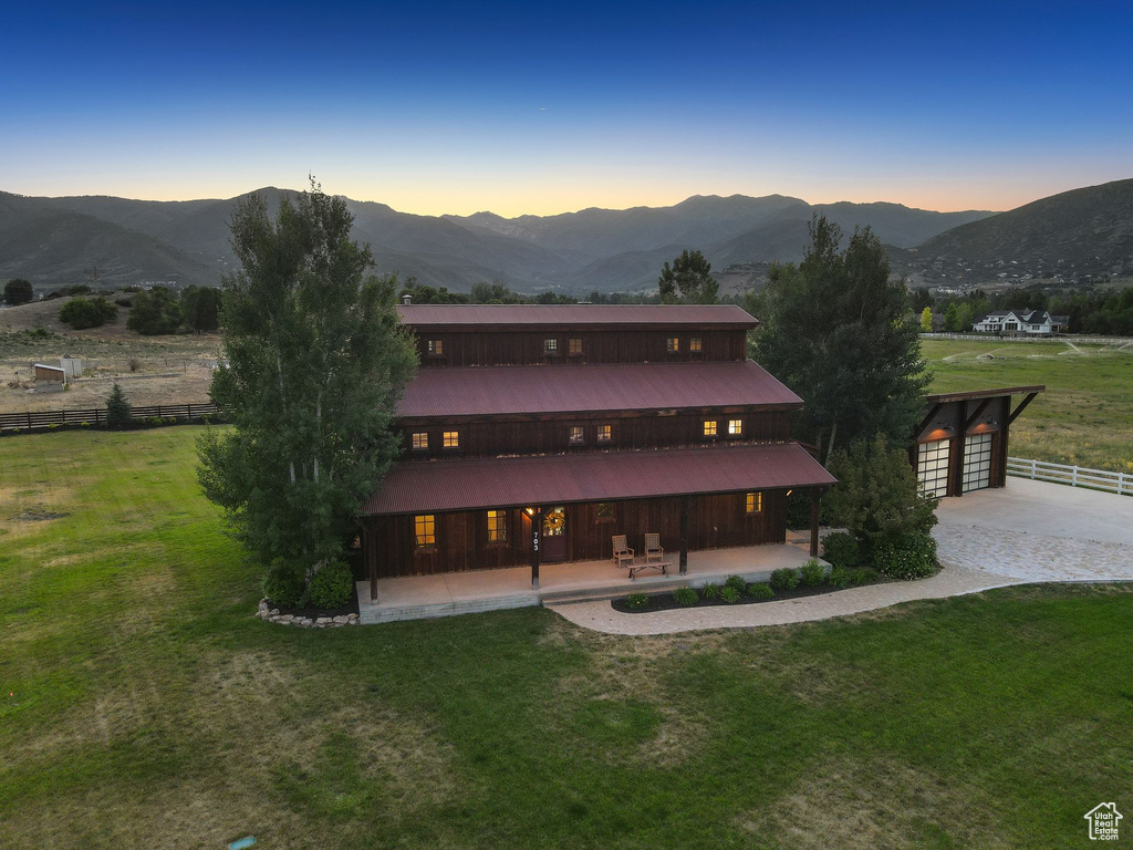 Rear view of property with a patio and a mountain view