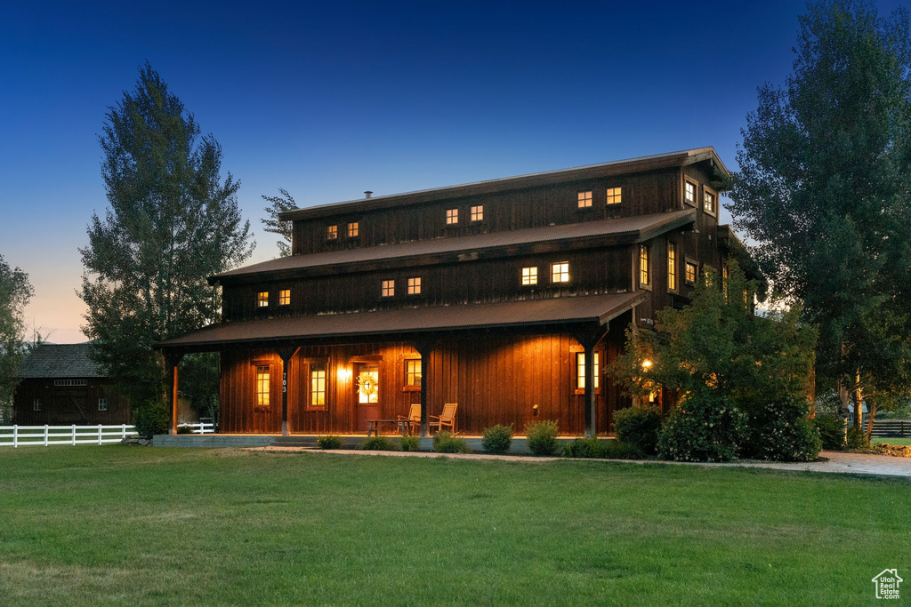 Rear view of house featuring a porch