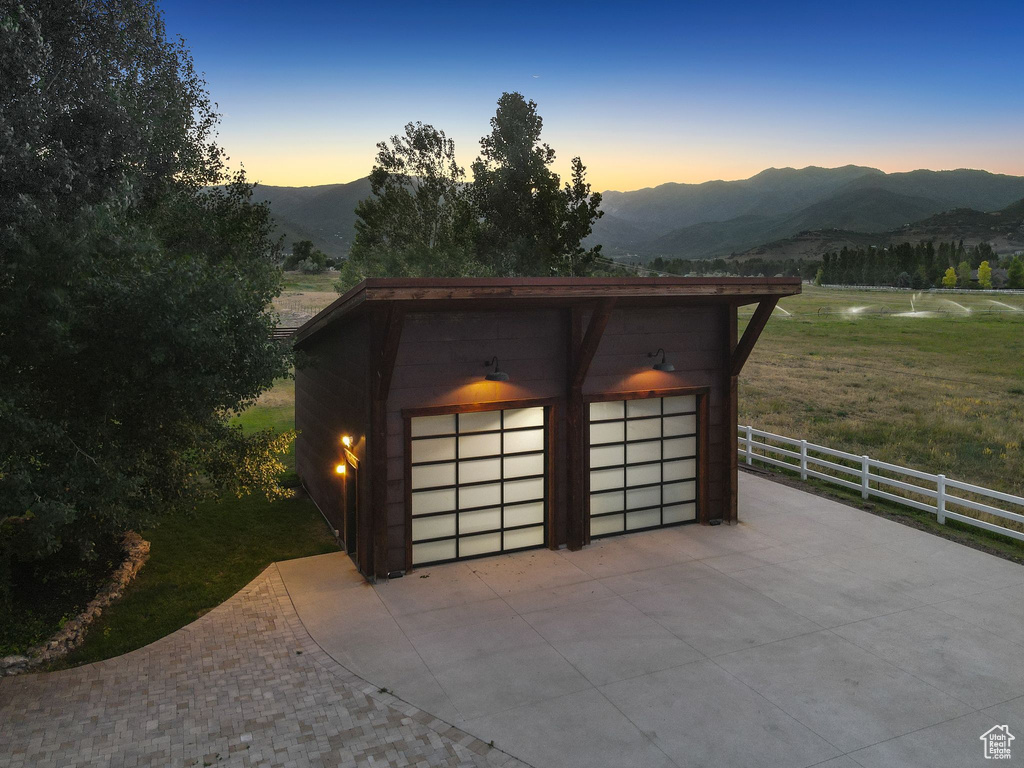 Detached garage with a mountain view