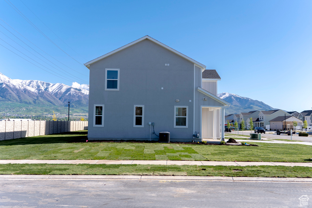 View of home's exterior with a mountain view