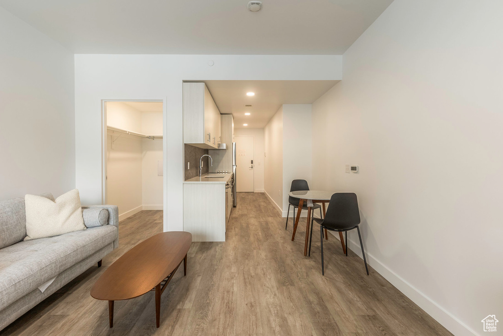 Living room featuring light hardwood / wood-style flooring and sink