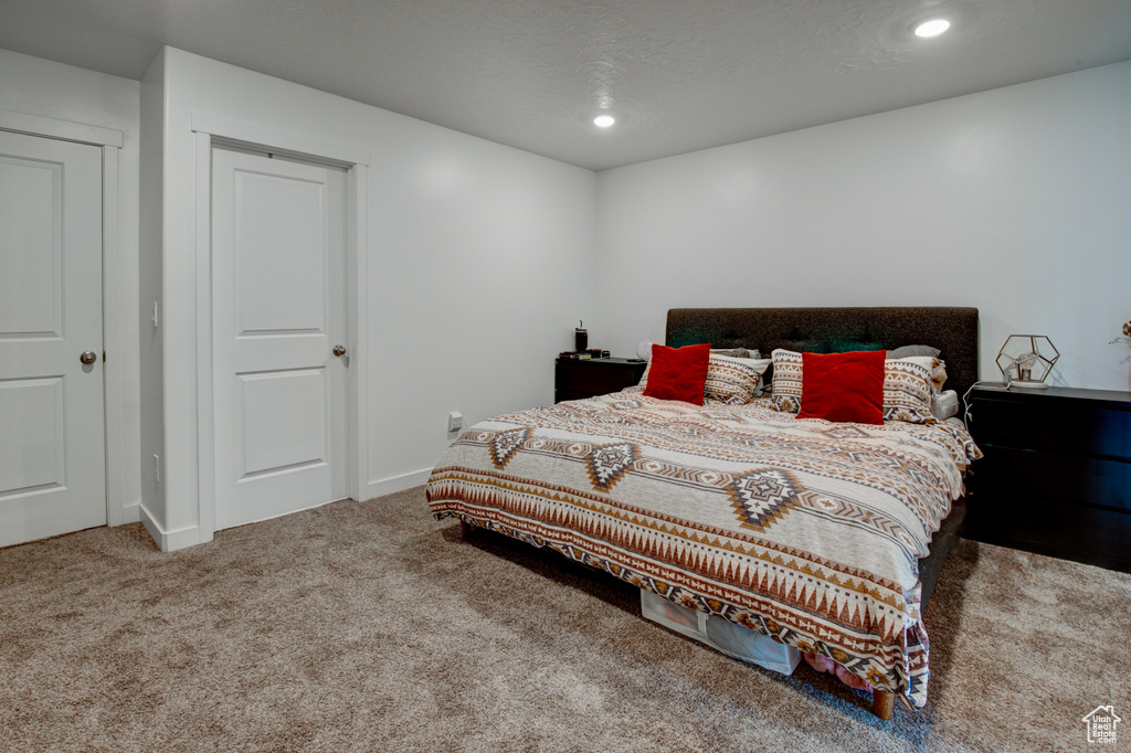 Bedroom with carpet floors, recessed lighting, and baseboards
