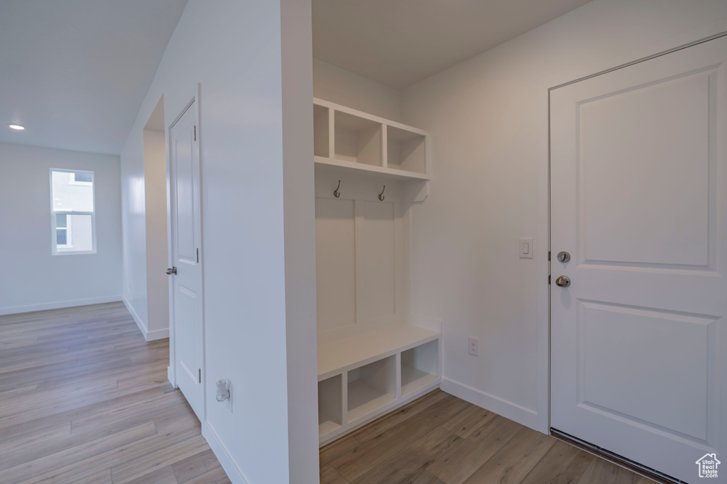 Mudroom with light wood-style flooring, baseboards, and recessed lighting