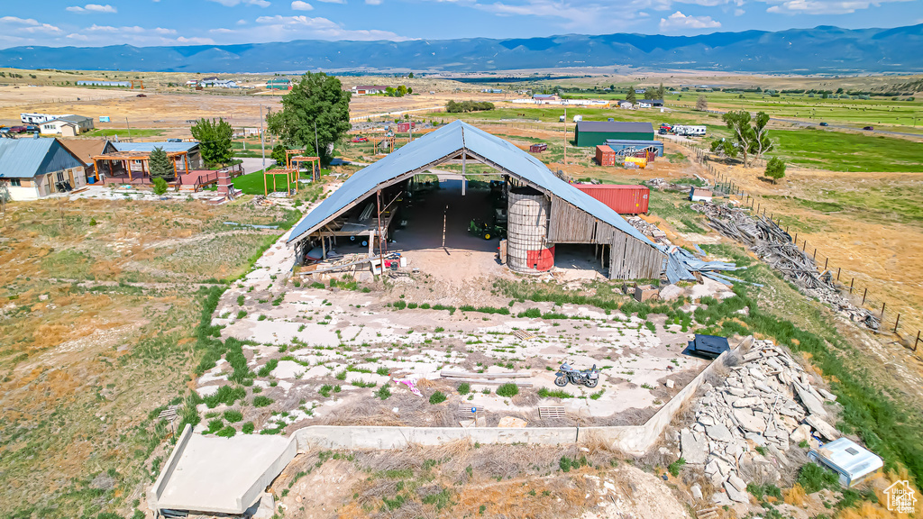 Birds eye view of property featuring a mountain view and a rural view