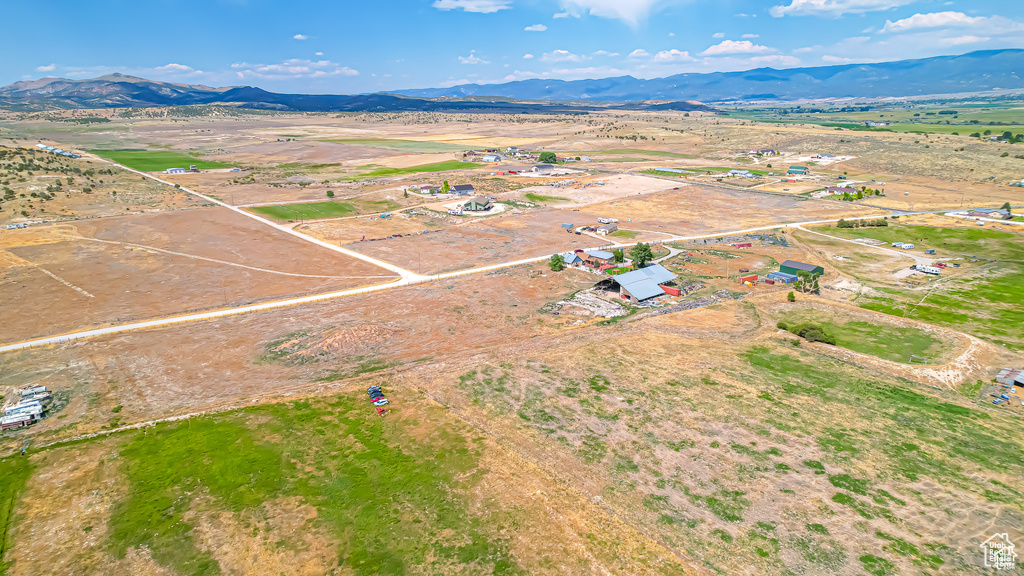 Birds eye view of property featuring a mountain view and a rural view