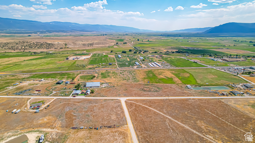 Aerial view featuring a rural view and a water and mountain view