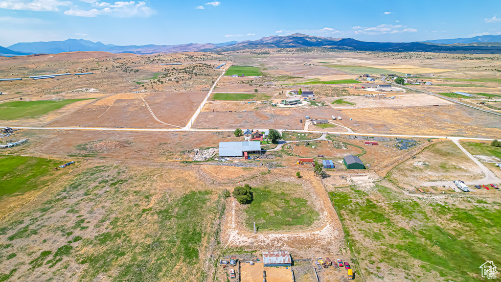 Birds eye view of property featuring a mountain view and a rural view