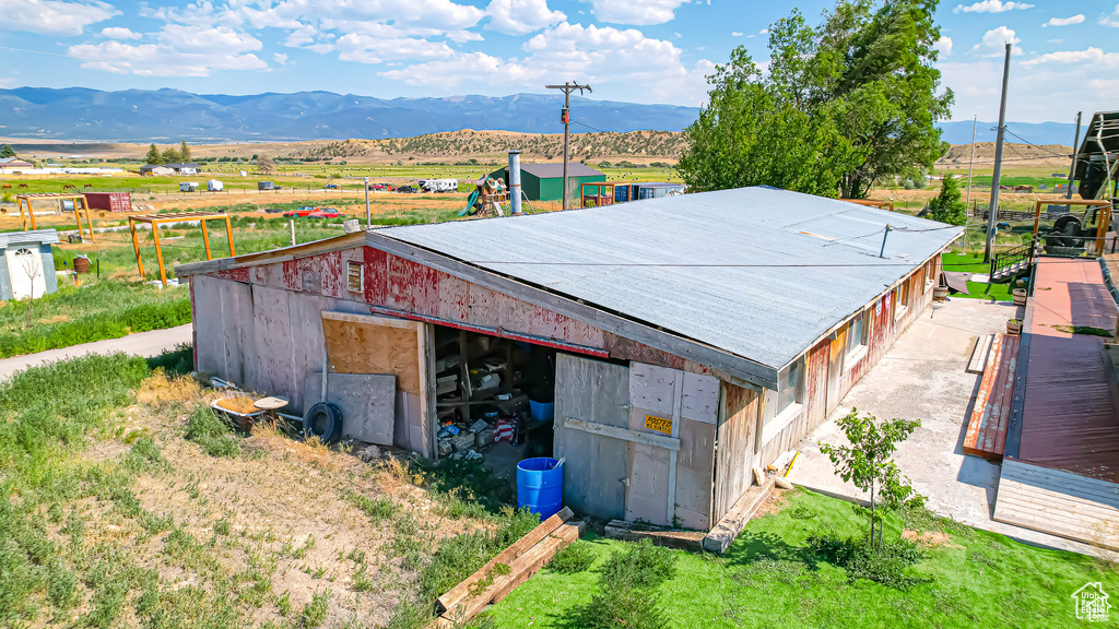 Exterior space with an outbuilding and a mountain view